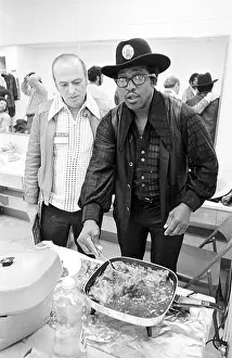 Prints of NEW YORK - MAY 6: Guitarist Bo Diddley digs in to some fried chicken backstage at Madison Square Garden in the concert movie Let the Good Times Roll on May 6, 1972 in New York City, New York Bo Diddley: Rhythm & Riffs Prints: Bo Diddley & Chuck Berry Let The Good Times Roll