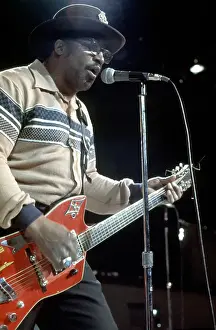 Prints of CIRCA 1976: Guitarist Bo Diddley plays his Gretsch electric guitar as he performs on a TV show in circa 1976. (Photo by Michael Ochs Archives/Getty Images) Bo Diddley: Rhythm & Riffs Prints: Bo Diddley Performs On A TV Show