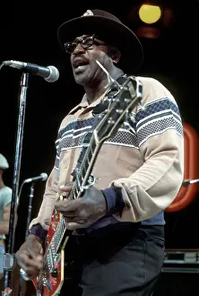 Prints of CIRCA 1976: Guitarist Bo Diddley plays his Gretsch electric guitar as he performs on a TV show in circa 1976. (Photo by Michael Ochs Archives/Getty Images) Bo Diddley: Rhythm & Riffs Prints: Bo Diddley Performs On A TV Show