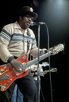 Prints of CIRCA 1976: Guitarist Bo Diddley plays his Gretsch electric guitar as he performs on a TV show in circa 1976. (Photo by Michael Ochs Archives/Getty Images) Bo Diddley: Rhythm & Riffs Prints: Bo Diddley Performs On A TV Show
