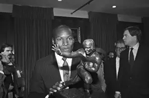 Bo Jackson Holding Heisman Trophy