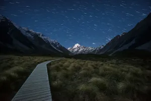Mt Cook New Zealand Prints: Boardwalk in the Hooker valley in the middle of stars tail to Aoraki national park