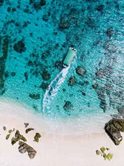 Images Dated 15th March 2018: Boat and clear blue tropical water from above, Kerama Islands, Okinawa, Japan