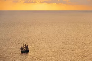 Boat sailing in the sea during sunset