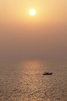 Boat on the sea, sunset, Kovalam, Kerala, southern India, India, Asia