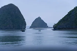 Images Dated 7th November 2005: Boats and islands at dusk on Vietnamese bay