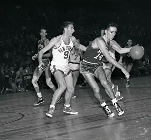Bob Cousy Dribbling Around Opponent