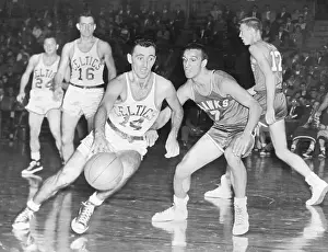 Basketball Uniform Prints: Bob Cousy Dribbling Past an Opponent