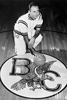 Newton Prints: Bob Cousy Kneeling on Basketball Court