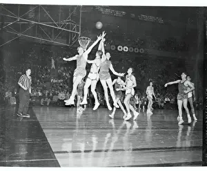 Bob Davies and Dick Farley Competing for Possession of the Ball