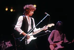 Prints of ATLANTA - DECEMBER 12: Bob Dylan performing onstage playing his Fender Stratocaster electric guitar and wearing a vest on December 12, 1978 at the Omni in Atlanta, Georgia Blowin' in the Wind: Bob Dylan's Photographic Legacy: Bob Dylan In Atlanta
