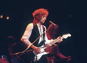 Prints of ATLANTA - DECEMBER 12: Bob Dylan performing onstage playing his Fender Stratocaster electric guitar and wearing a vest on December 12, 1978 at the Omni in Atlanta, Georgia Blowin' in the Wind: Bob Dylan's Photographic Legacy: Bob Dylan In Atlanta