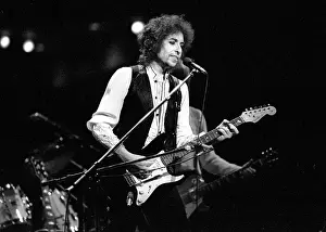 Prints of ATLANTA - DECEMBER 12: Bob Dylan performing onstage playing his Fender Stratocaster electric guitar and wearing a vest on December 12, 1978 at the Omni in Atlanta, Georgia Blowin' in the Wind: Bob Dylan's Photographic Legacy: Bob Dylan In Atlanta