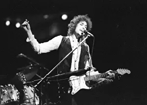 Prints of ATLANTA - DECEMBER 12: Bob Dylan performing onstage playing his Fender Stratocaster electric guitar and wearing a vest on December 12, 1978 at the Omni in Atlanta, Georgia Blowin' in the Wind: Bob Dylan's Photographic Legacy: Bob Dylan In Atlanta