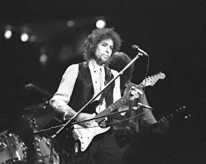 Prints of ATLANTA - DECEMBER 12: Bob Dylan performing onstage playing his Fender Stratocaster electric guitar and wearing a vest on December 12, 1978 at the Omni in Atlanta, Georgia Blowin' in the Wind: Bob Dylan's Photographic Legacy: Bob Dylan In Atlanta