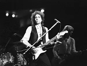 Prints of ATLANTA - DECEMBER 12: Bob Dylan performing onstage playing his Fender Stratocaster electric guitar and wearing a vest on December 12, 1978 at the Omni in Atlanta, Georgia Blowin' in the Wind: Bob Dylan's Photographic Legacy: Bob Dylan In Atlanta