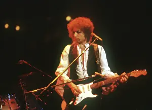 Prints of ATLANTA - DECEMBER 12: Bob Dylan performing onstage playing his Fender Stratocaster electric guitar and wearing a vest on December 12, 1978 at the Omni in Atlanta, Georgia Blowin' in the Wind: Bob Dylan's Photographic Legacy: Bob Dylan In Atlanta