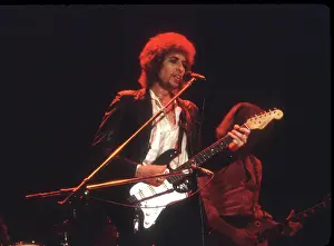 Prints of SAVANNAH, GA - DECEMBER 8: Bob Dylan performing onstage playing his Fender Stratocaster electric guitar on December 8, 1978 at the Civic Center Arena in Savannah, Georgia Blowin' in the Wind: Bob Dylan's Photographic Legacy: Bob Dylan Performs In Savannah