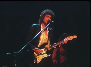 Prints of SAVANNAH, GA - DECEMBER 8: Bob Dylan performing onstage playing his Fender Stratocaster electric guitar on December 8, 1978 at the Civic Center Arena in Savannah, Georgia Blowin' in the Wind: Bob Dylan's Photographic Legacy: Bob Dylan Performs In Savannah
