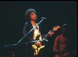 Prints of SAVANNAH, GA - DECEMBER 8: Bob Dylan performing onstage playing his Fender Stratocaster electric guitar on December 8, 1978 at the Civic Center Arena in Savannah, Georgia Blowin' in the Wind: Bob Dylan's Photographic Legacy: Bob Dylan Performs In Savannah