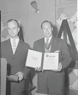 Bob Feller Posing with Pitching Award