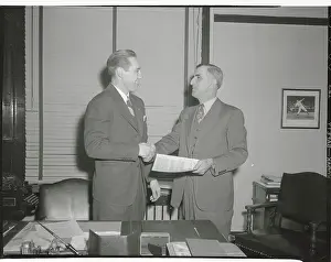 Bob Feller and Roger Peckinpaugh Shaking Hands