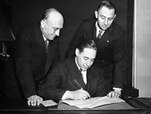 Rookie Prints: Bob Feller Signs Contract;Men Look On
