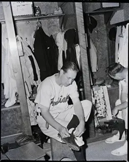 Tying Prints: Bob Feller Untying Shoe In Clubhouse