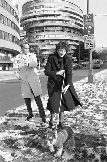 Spouse Prints: Bob And Liz Dole Walk Their Dog Leader