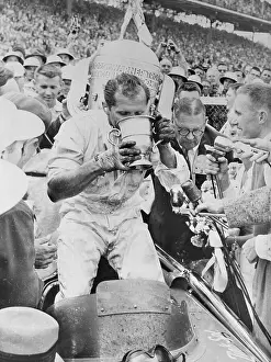 Bob Sweikert Drinking From Trophy