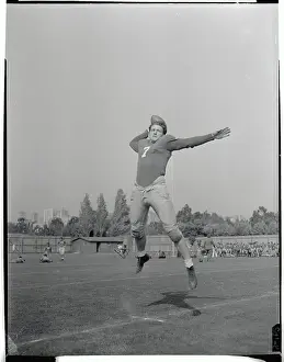 Bob Waterfield Jumping in the Air with Ball in Hand