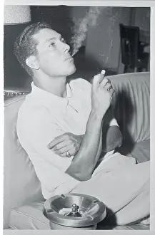 Bobby Avila Sitting and Smoking