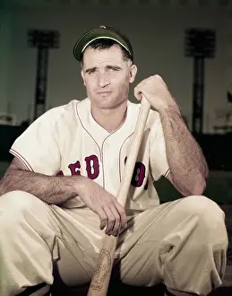 Bobby Doerr Sitting with Baseball Bat