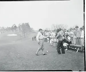 Bobby Jones Handing a Drink to His Caddy