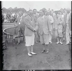 Defeat Prints: Bobby Jones and Von Elm Shaking Hands