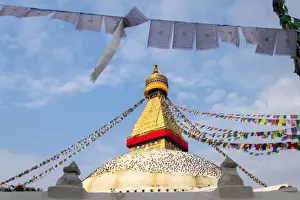 Bodnath stupa with prayer flags at sunrise (Nepal)