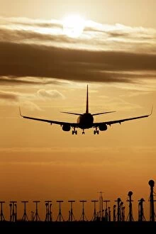 Evening Atmosphere Collection: Boeing 737 aircraft landing at an airport at sunset, Stansted, Essex, England, United Kingdom
