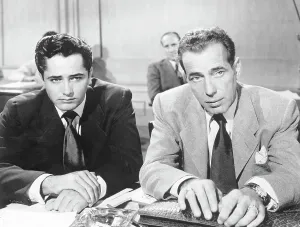 Prints of (Original Caption) 03/18/1949. TAKING THE BOGIE OUT OF BOGIE. (fifth-end of set). Armed only with a lawyer's briefcase, Bogart prepares to battle just with words in Knock On Any Door The Essence of Cool: Bogart In Movie Knock On Any Door