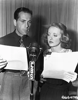 Prints of 1937: American actors Humphrey Bogart and Bette Davis stand at a CBS radio microphone, holding scripts for a broadcast, in front of a curtain The Essence of Cool: Bogey And Bette