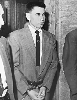 Airline Prints: Bomber Of Plane In Handcuffs;Led To Court