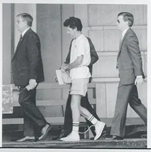 Bombing Suspect Walking With Government Agents to Court