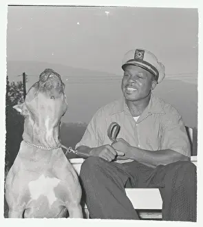 Boxer Archie Moore with His Dog