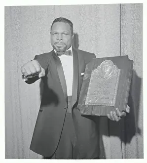 Plaque Prints: Boxer Archie Moore Making Fist and Holding Plaque