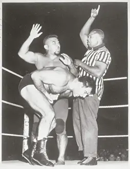 Fort Wayne Prints: Boxer Archie Moore as Referee to Wrestlers