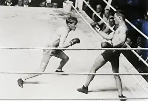 Boxer Backing Opponent Into Corner