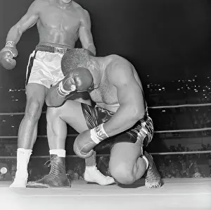 Head In Hands Prints: Boxer Cassius Clay Defeating Archie Moore