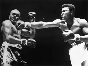 Boxer Cassius Clay Punching Doug Jones