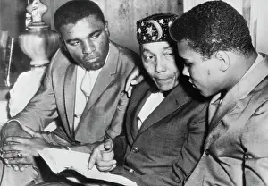 Boxer Cassius Clay Speaking to Elijah Muhammad Poole