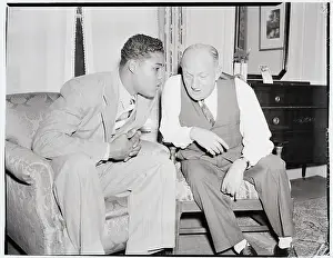 Boxer Joe Louis Talking With Fight Promoter