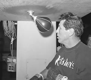 Boxer Joey Giardello Near Punching Equipment